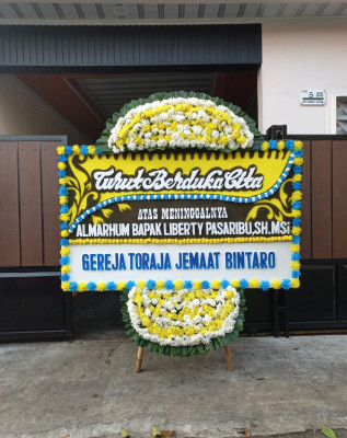Papan Bunga Duka di Okhika